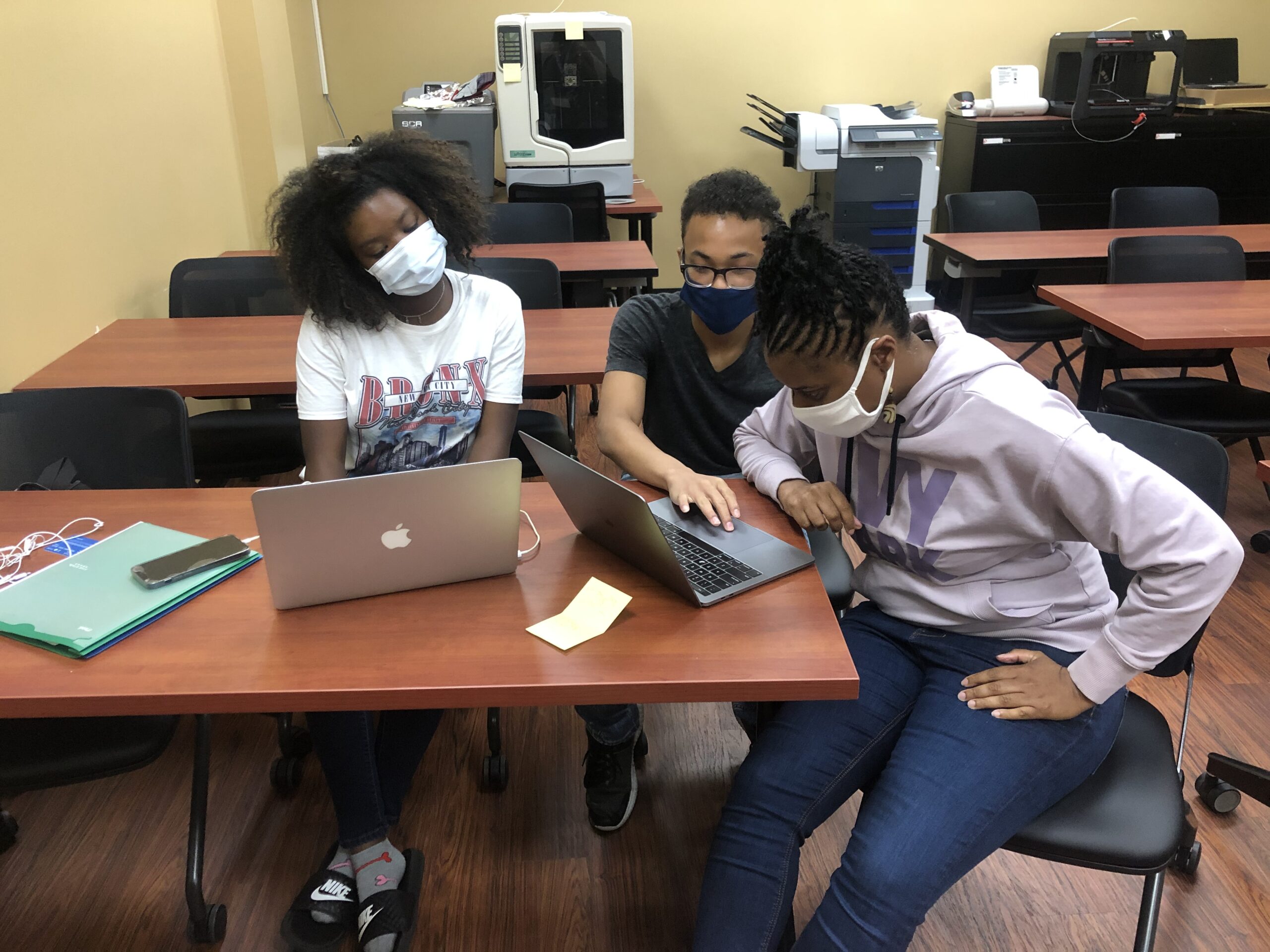 Assata working with students at Olive Harvey College. Black Math Genius